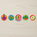Five colorful AMC Farms vinyl stickers arranged on a light wooden surface